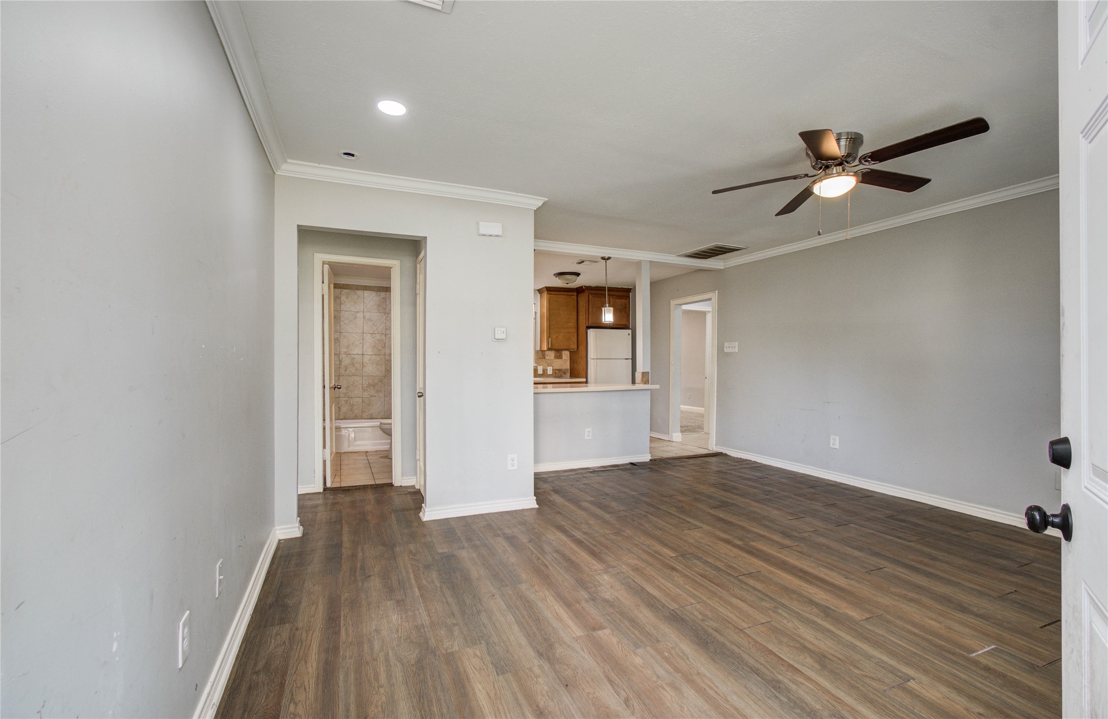6830 New York Street Houston, TX 77021 - Photo 4 of 23 wooden floor in an empty room with a window