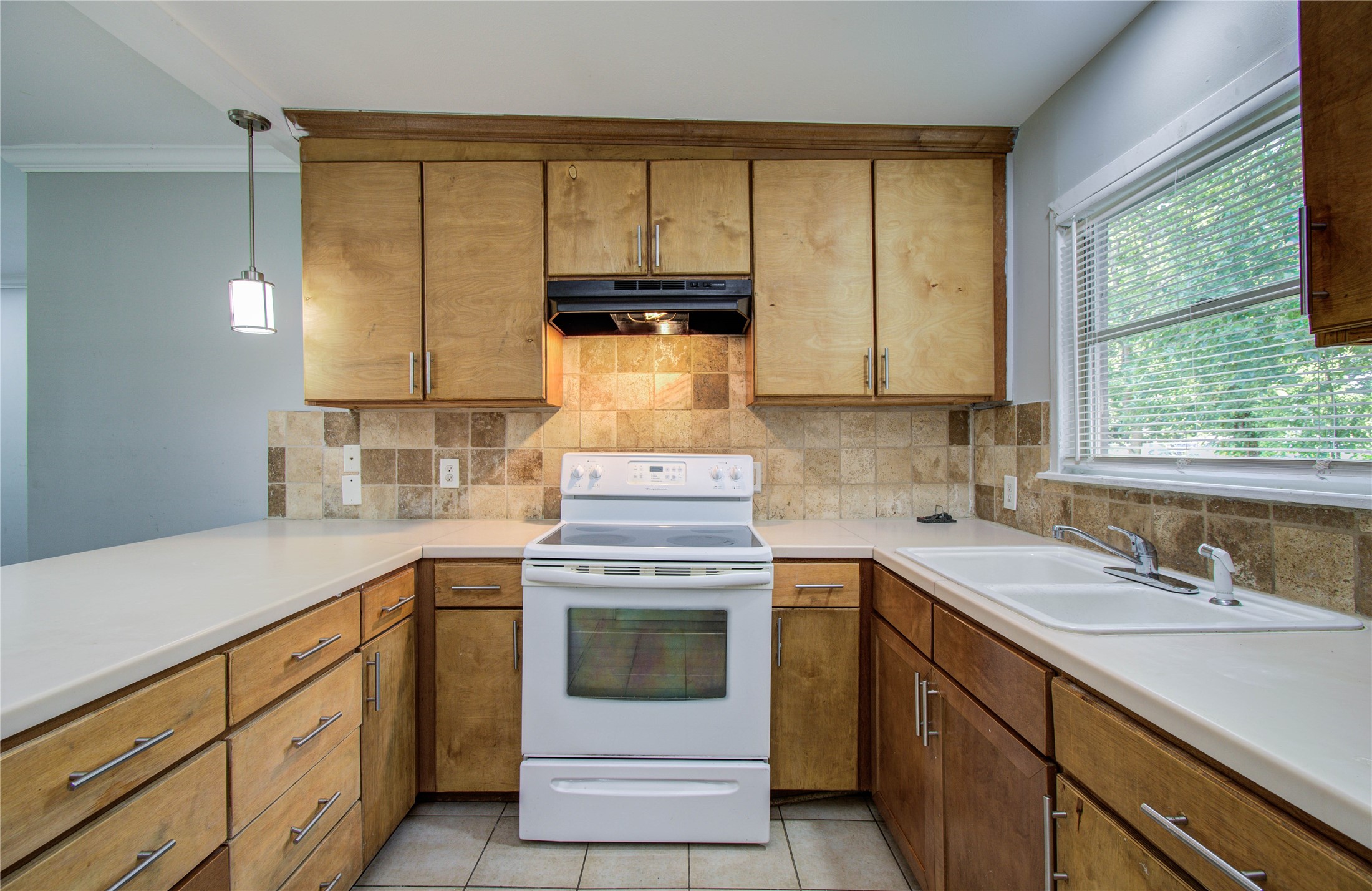 6830 New York Street Houston, TX 77021 - Photo 9 of 23 a kitchen with a sink stove and cabinets