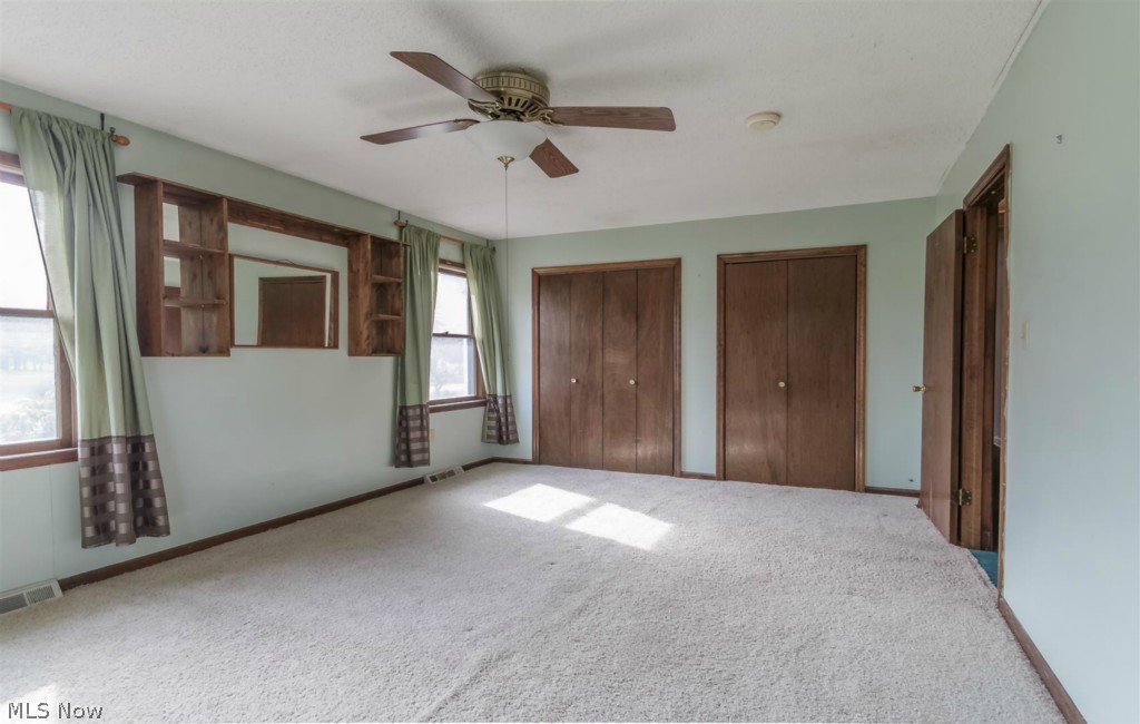 3618 Dayton Road Madison, OH 44057 - Photo 12 of 23 Bedroom 2 on main level with three sets of windows!