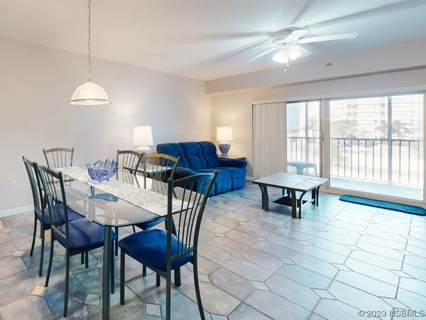 a view of a dining room with furniture window and outside view