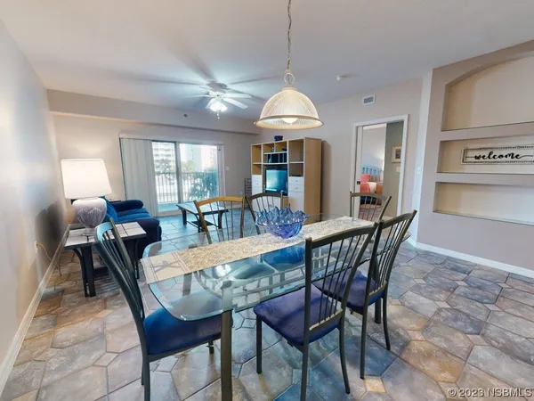 a view of a dining room with furniture