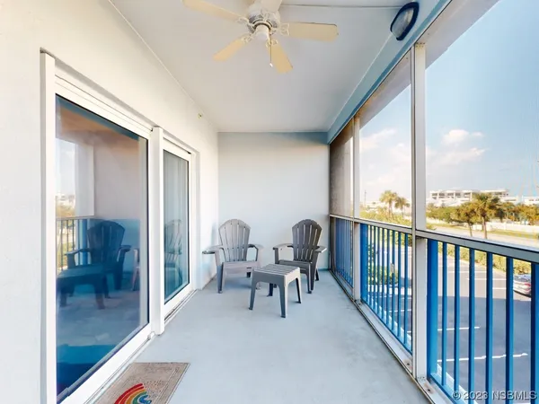 a view of a balcony with furniture
