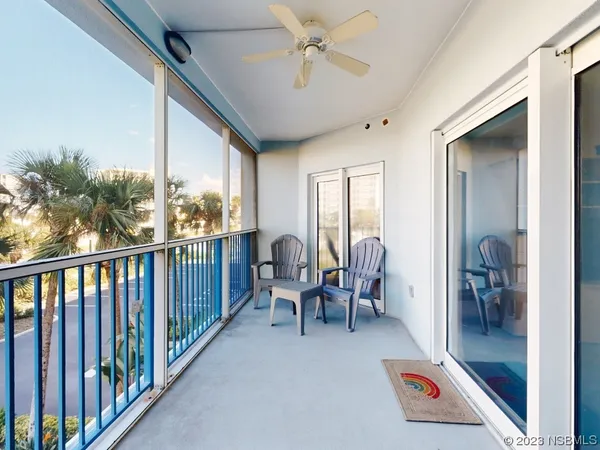 a view of a balcony with furniture