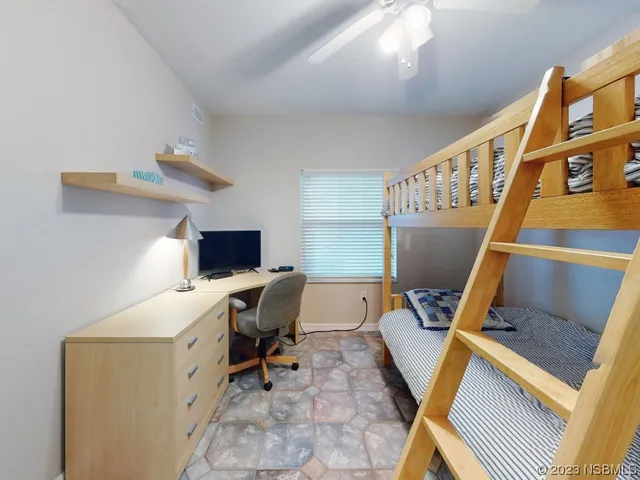 a view of a workspace with furniture and a workspace