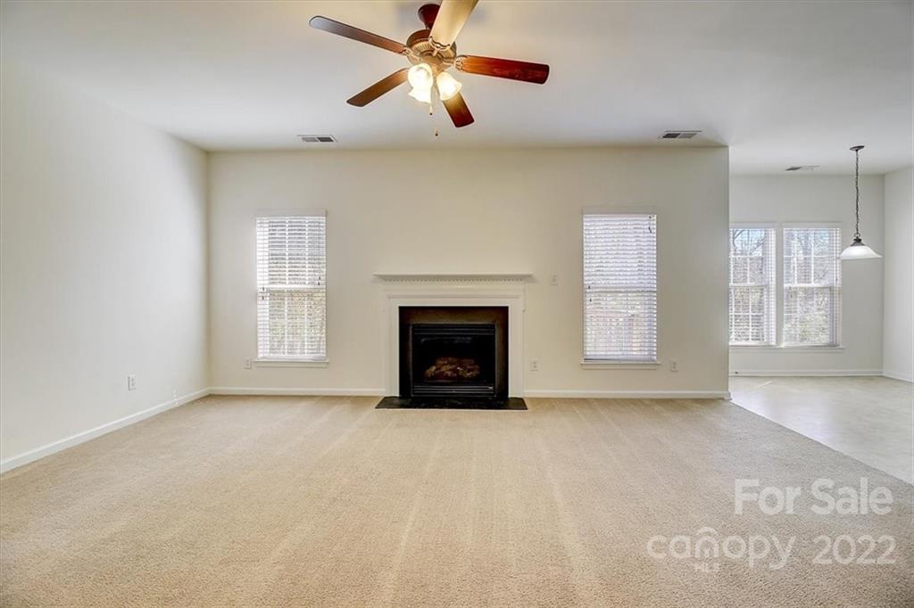 11223 Winget Pond Road Charlotte, NC 28278 - Photo 11 of 43 a view of an empty room with window and fireplace