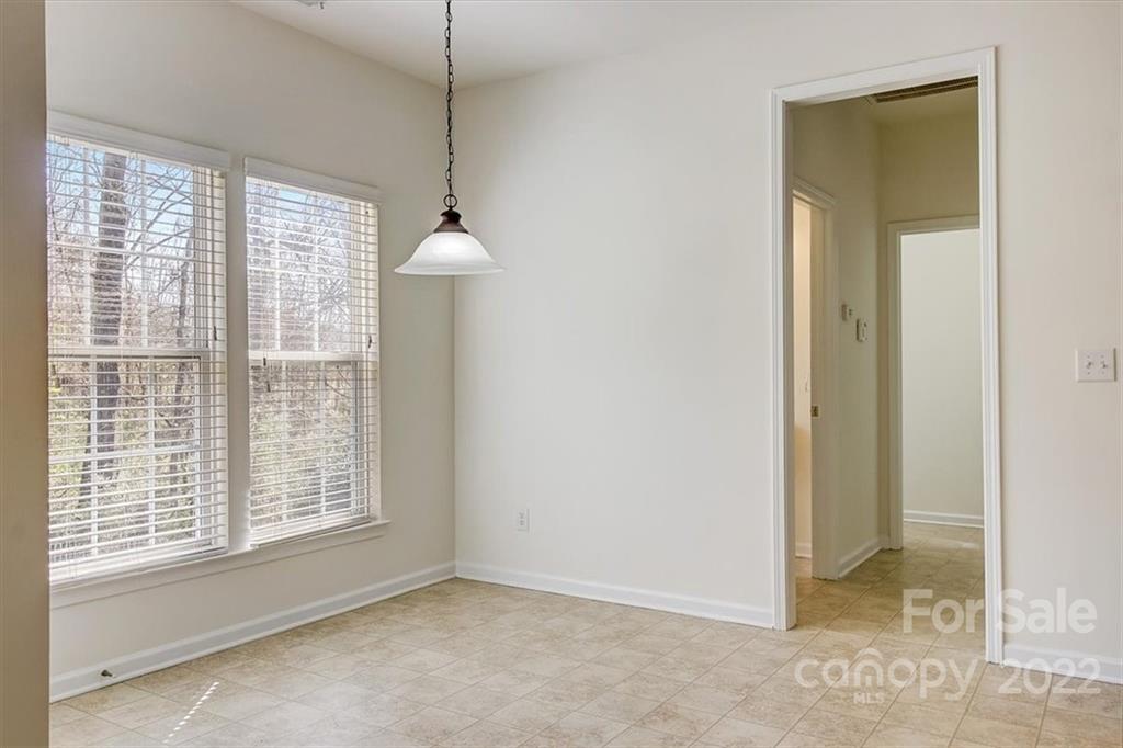 11223 Winget Pond Road Charlotte, NC 28278 - Photo 14 of 43 a view of an empty room with a window