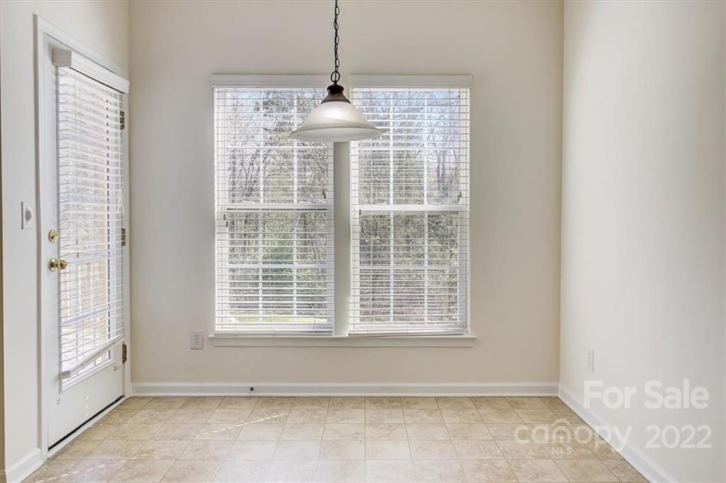 11223 Winget Pond Road Charlotte, NC 28278 - Photo 15 of 43 a view of empty room with windows