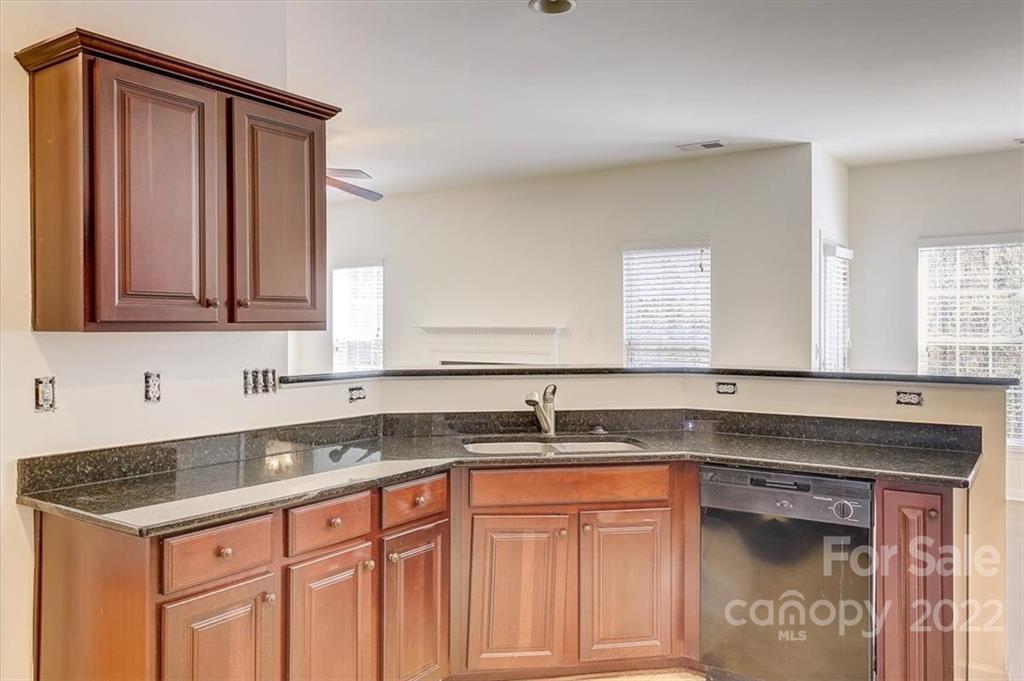 11223 Winget Pond Road Charlotte, NC 28278 - Photo 19 of 43 a kitchen with stainless steel appliances granite countertop a sink stove and cabinets