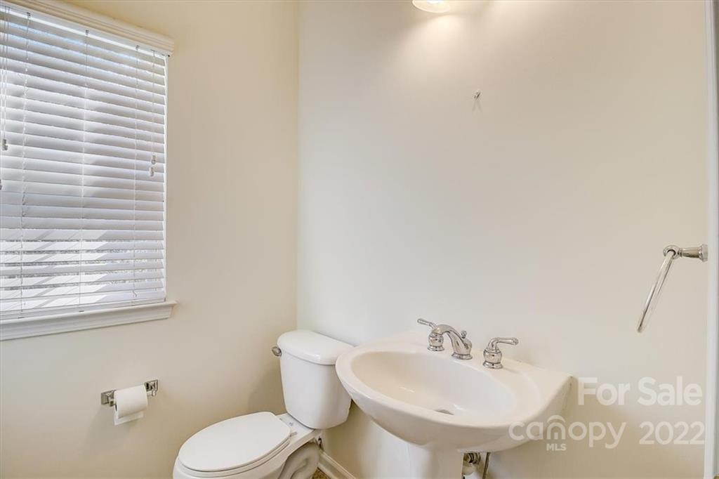 11223 Winget Pond Road Charlotte, NC 28278 - Photo 20 of 43 a bathroom with a sink and a toilet