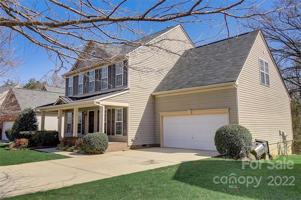 11223 Winget Pond Road Charlotte, NC 28278 - Photo 2 of 43 a view of a house with a yard and garage