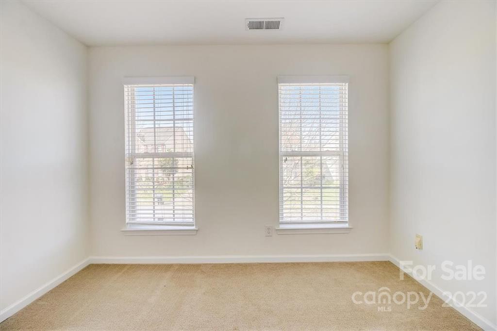 11223 Winget Pond Road Charlotte, NC 28278 - Photo 23 of 43 an empty room with windows