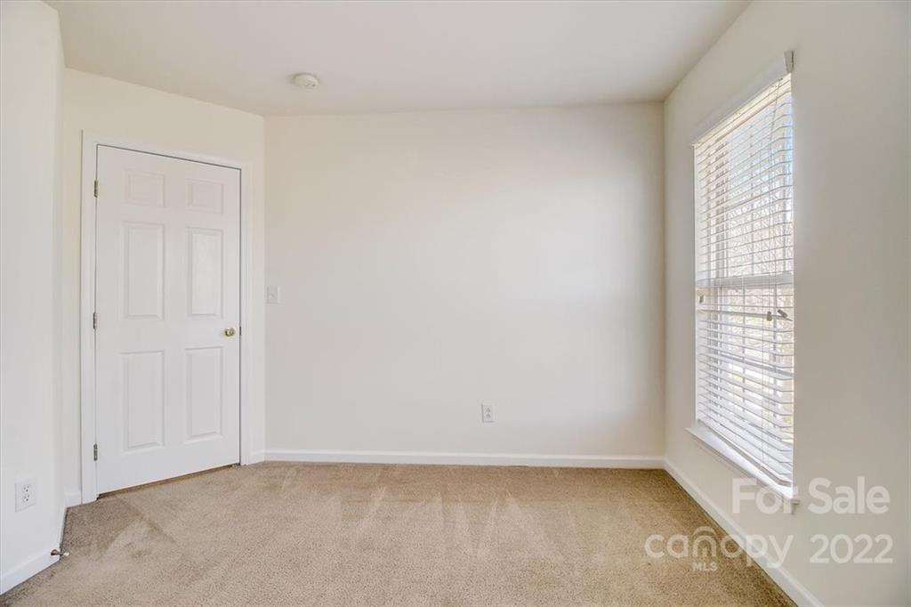 11223 Winget Pond Road Charlotte, NC 28278 - Photo 24 of 43 an empty room with a window