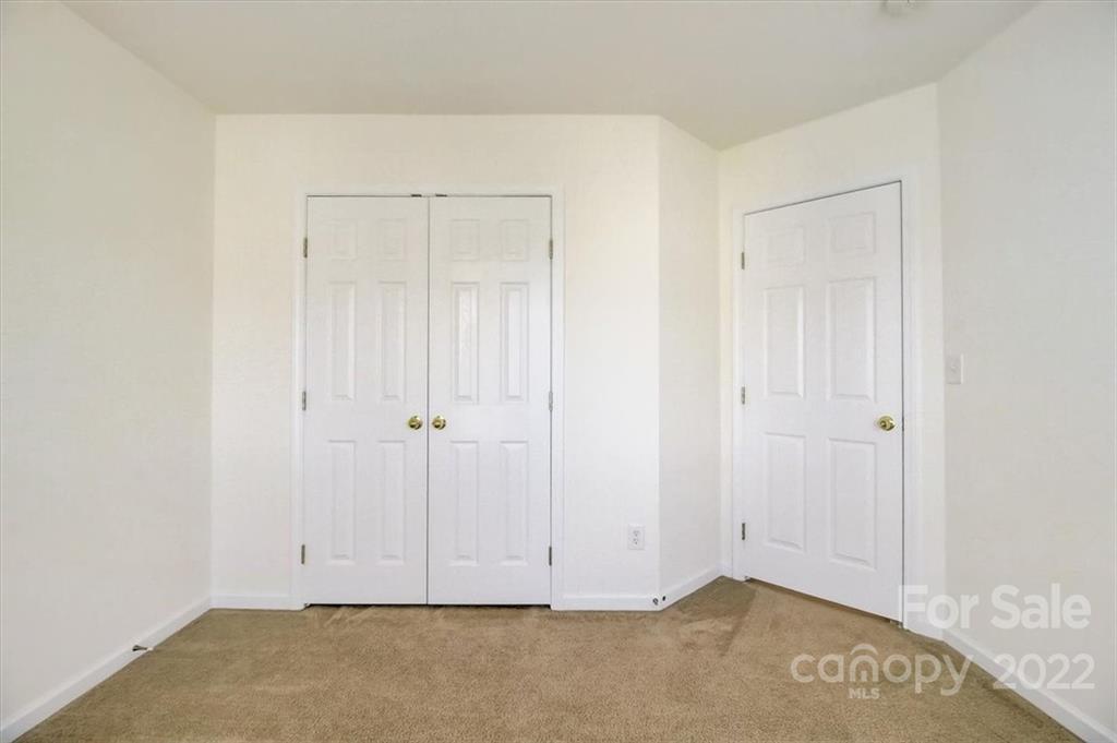 11223 Winget Pond Road Charlotte, NC 28278 - Photo 25 of 43 an empty room with closet area