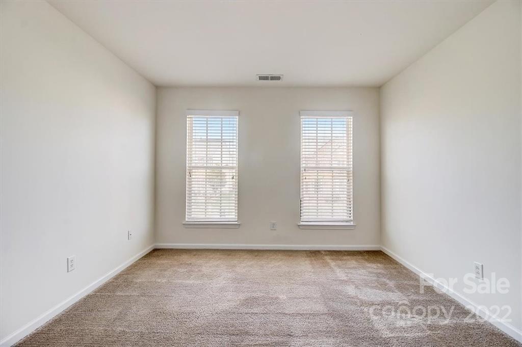 11223 Winget Pond Road Charlotte, NC 28278 - Photo 27 of 43 an empty room with windows