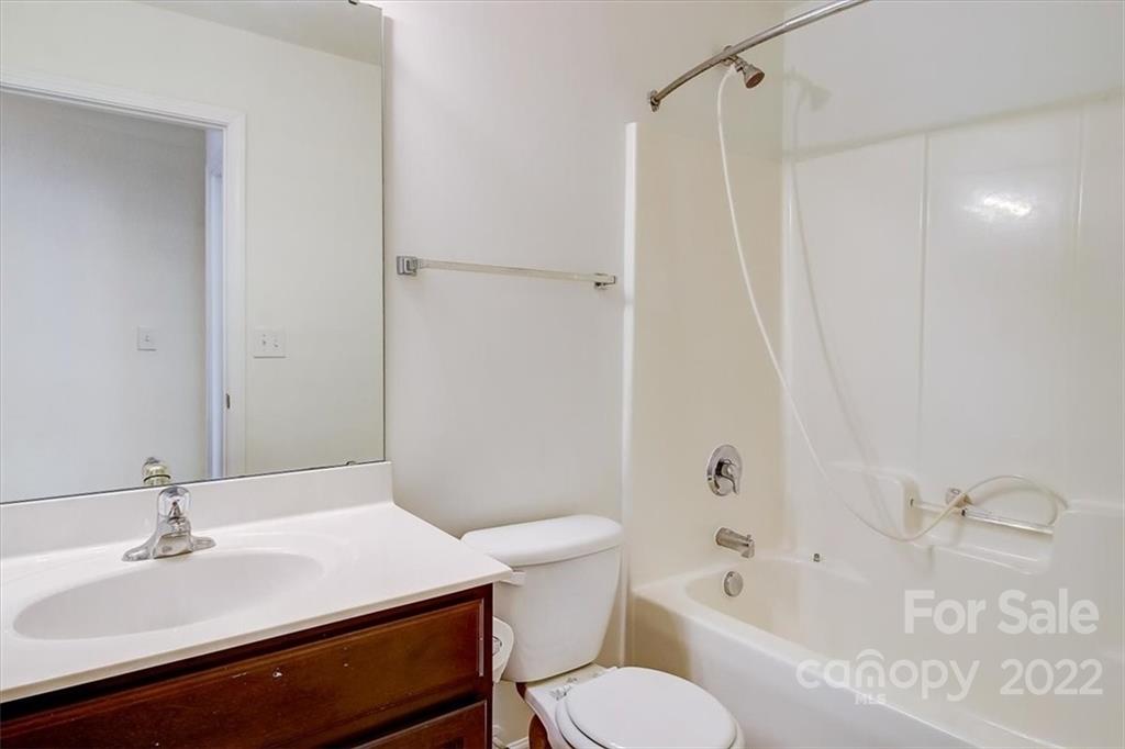 11223 Winget Pond Road Charlotte, NC 28278 - Photo 35 of 43 a bathroom with a sink toilet and shower