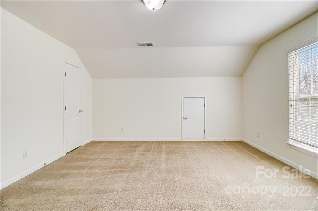 11223 Winget Pond Road Charlotte, NC 28278 - Photo 37 of 43 an empty room with a window