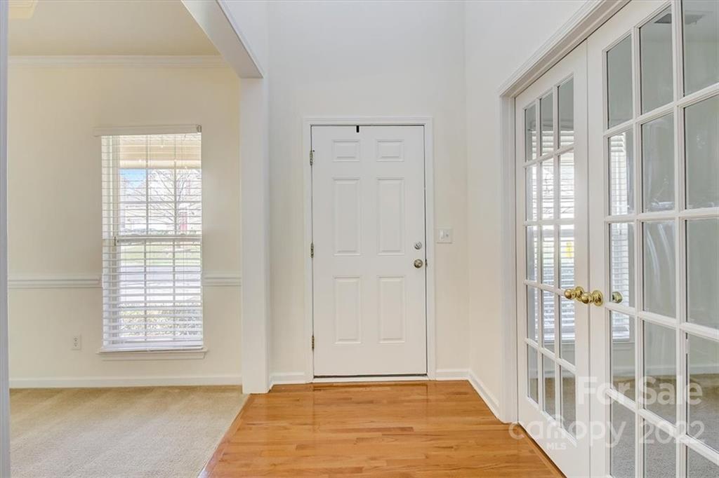 11223 Winget Pond Road Charlotte, NC 28278 - Photo 4 of 43 a view of an empty room with a window