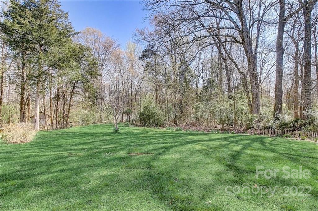 11223 Winget Pond Road Charlotte, NC 28278 - Photo 41 of 43 a big yard with lots of green space and trees