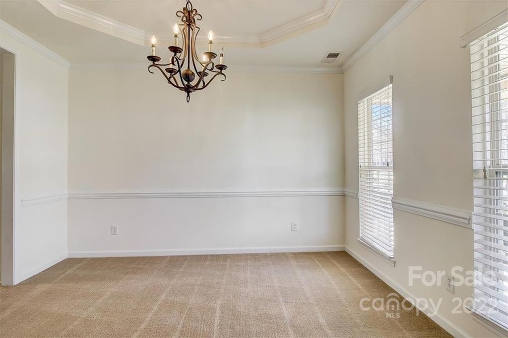 11223 Winget Pond Road Charlotte, NC 28278 - Photo 6 of 43 a view of a chandelier in big room and chandelier
