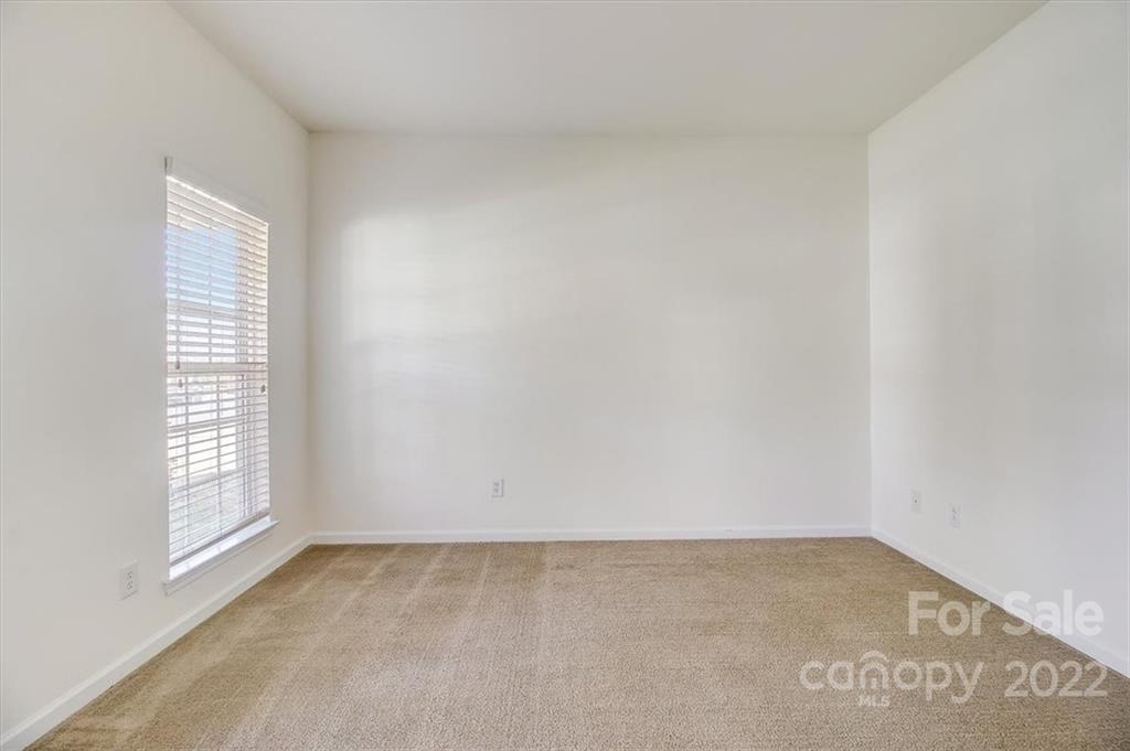 11223 Winget Pond Road Charlotte, NC 28278 - Photo 7 of 43 an empty room with windows