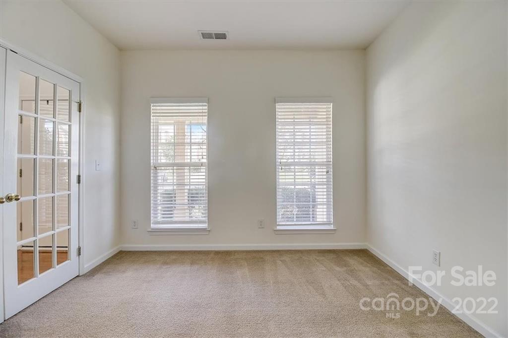 11223 Winget Pond Road Charlotte, NC 28278 - Photo 8 of 43 a view of an empty room with a window