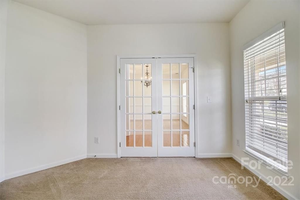 11223 Winget Pond Road Charlotte, NC 28278 - Photo 9 of 43 an empty room with windows