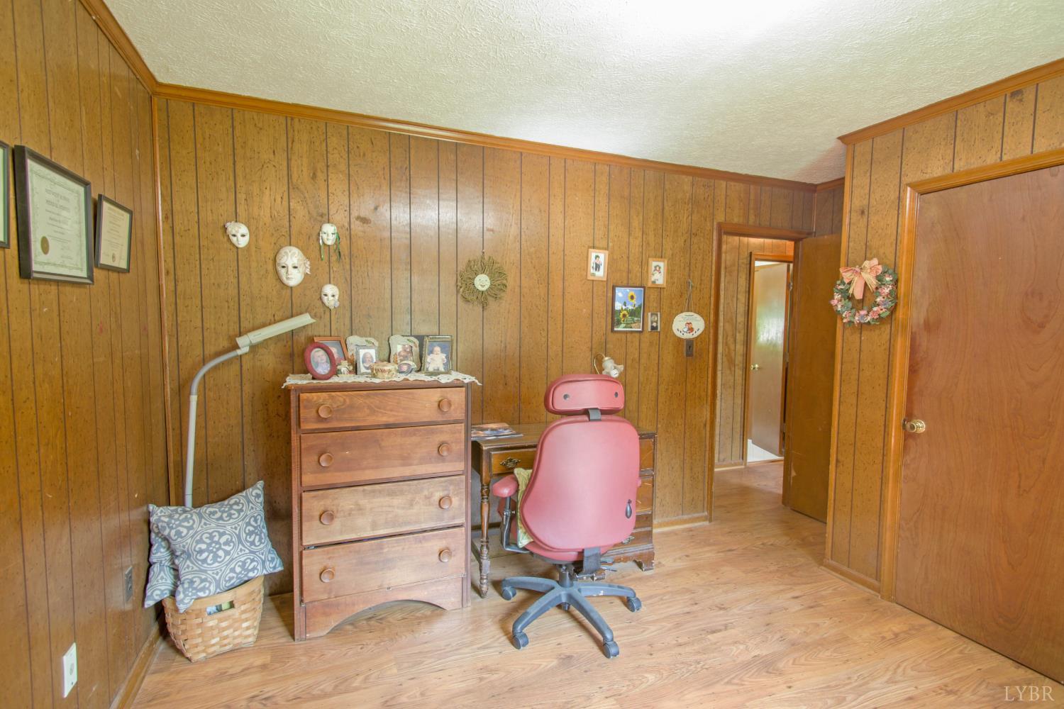 1494 Buffalo Mill Road Evington, VA 24550 - Photo 18 of 75 a view of a livingroom with furniture and a lamp