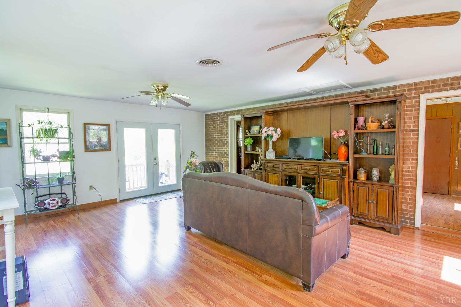 1494 Buffalo Mill Road Evington, VA 24550 - Photo 25 of 75 a living room with furniture and a wooden floor