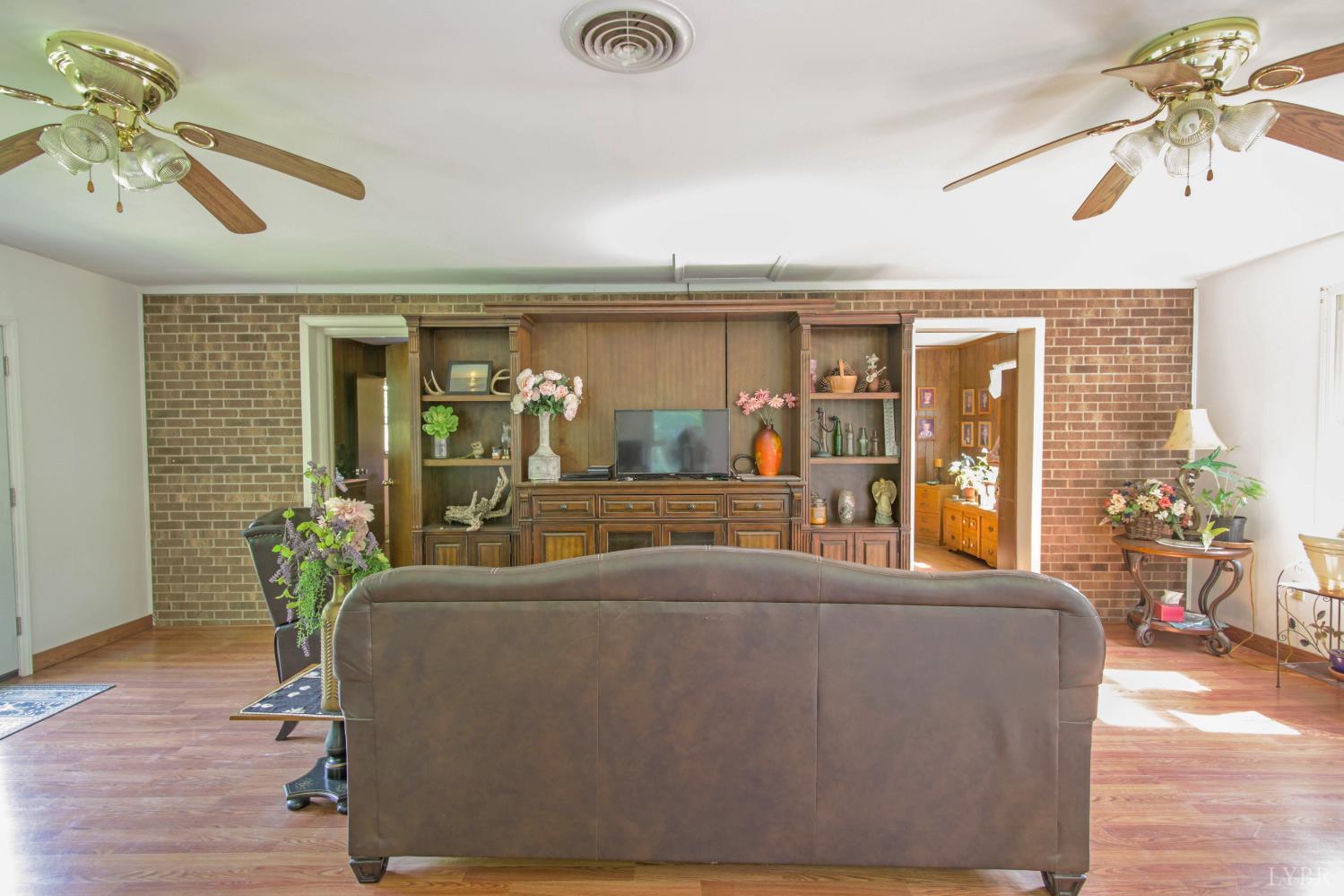 1494 Buffalo Mill Road Evington, VA 24550 - Photo 26 of 75 a living room with furniture and a chandelier