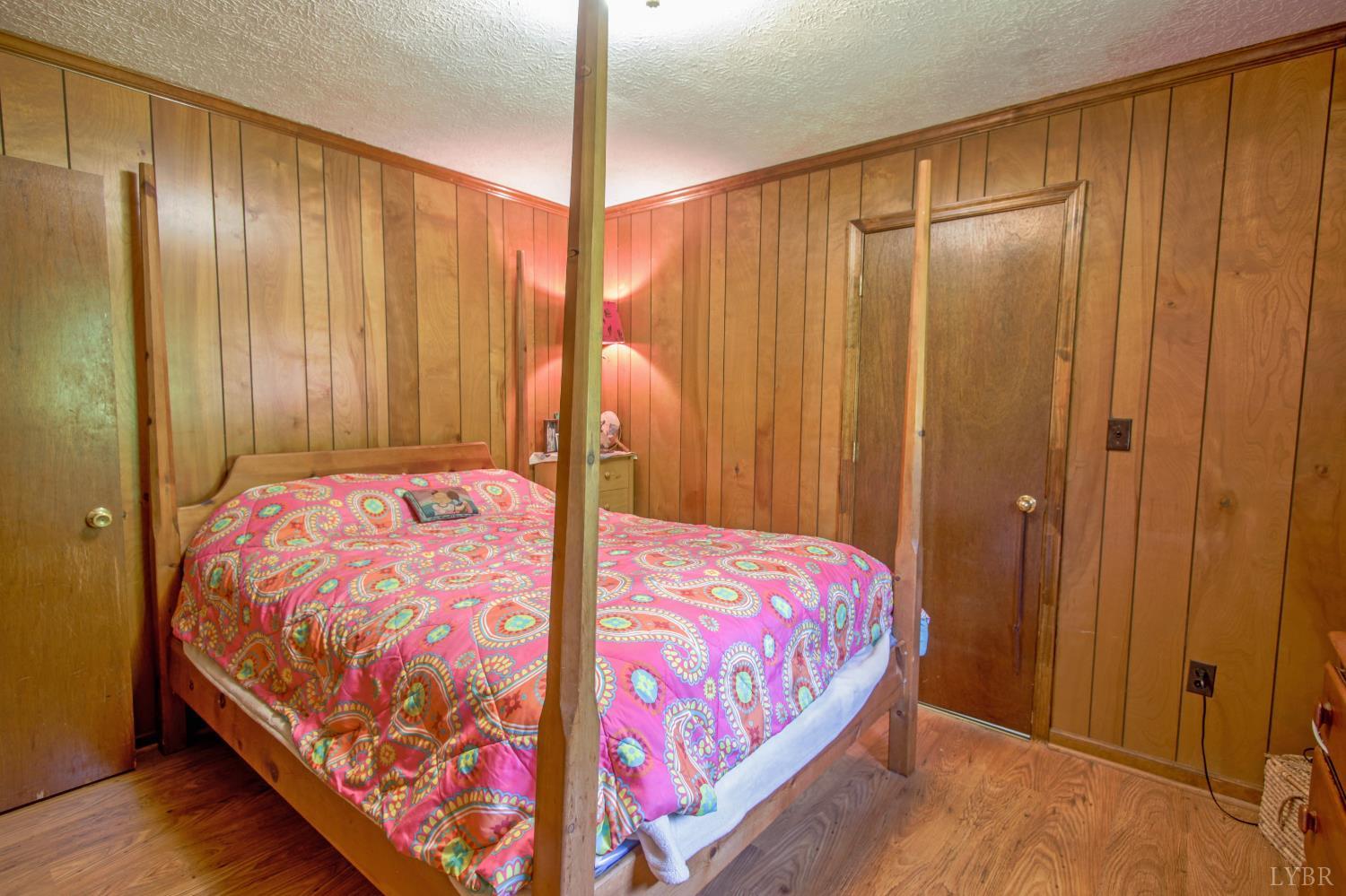 1494 Buffalo Mill Road Evington, VA 24550 - Photo 32 of 75 a bedroom with a bed and a mirror