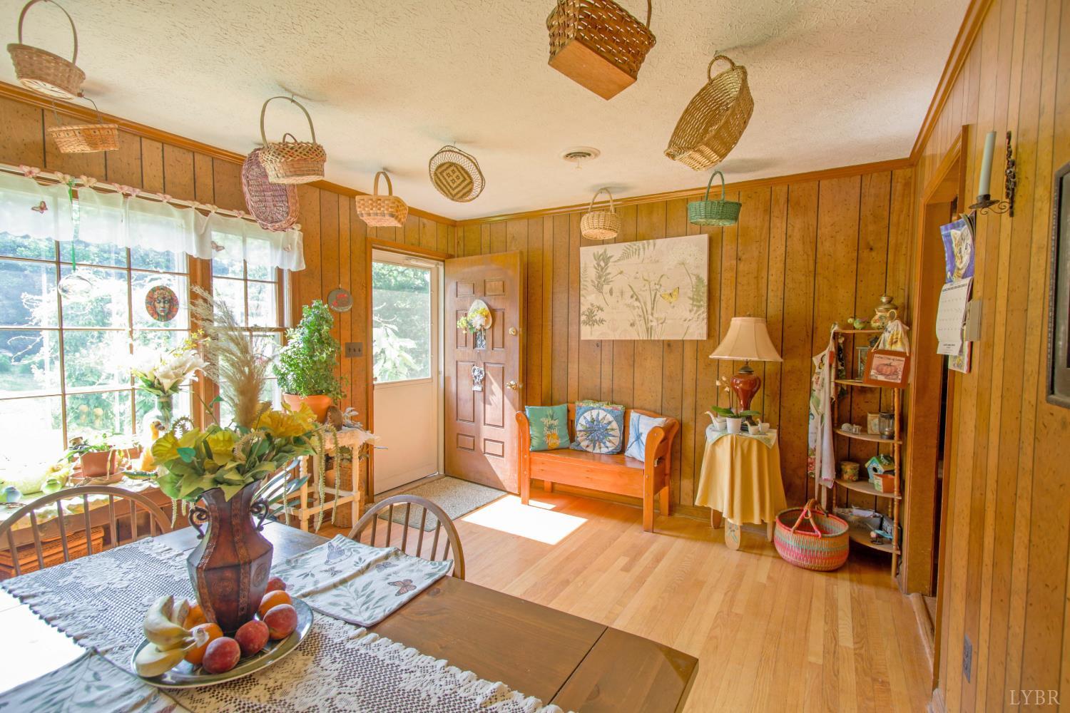 1494 Buffalo Mill Road Evington, VA 24550 - Photo 6 of 75 a living room with furniture and a chandelier