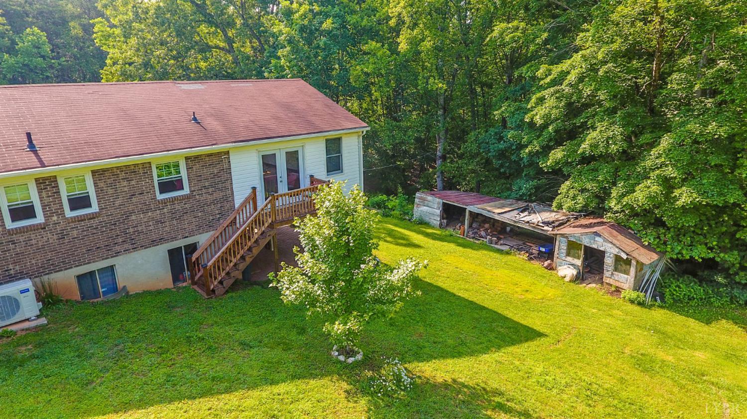1494 Buffalo Mill Road Evington, VA 24550 - Photo 62 of 75 a aerial view of a house with a yard table and chairs