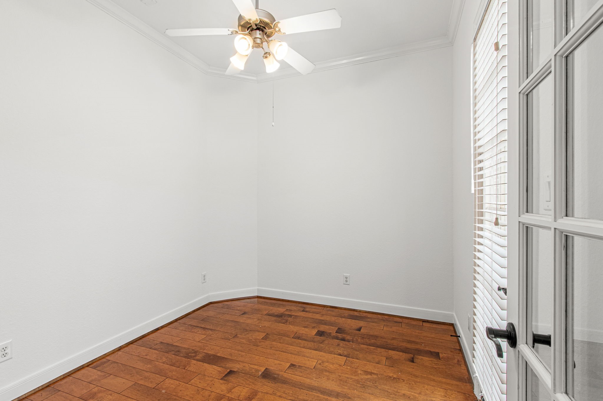 70 Shell Port Square The Woodlands, TX 77380 - Photo 17 of 50 a view of a room with wooden floor and fan