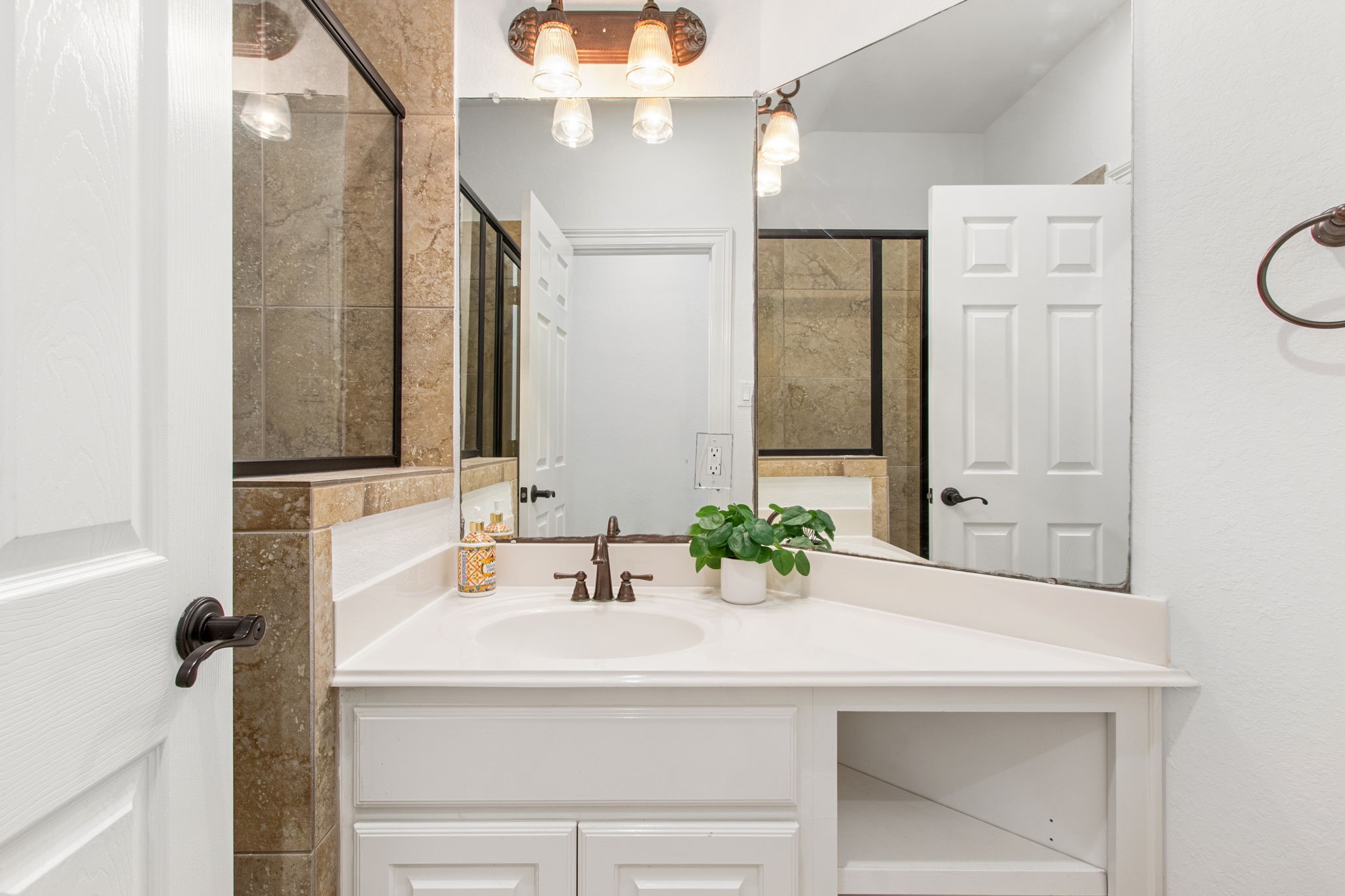 70 Shell Port Square The Woodlands, TX 77380 - Photo 18 of 50 a bathroom with a sink and a mirror