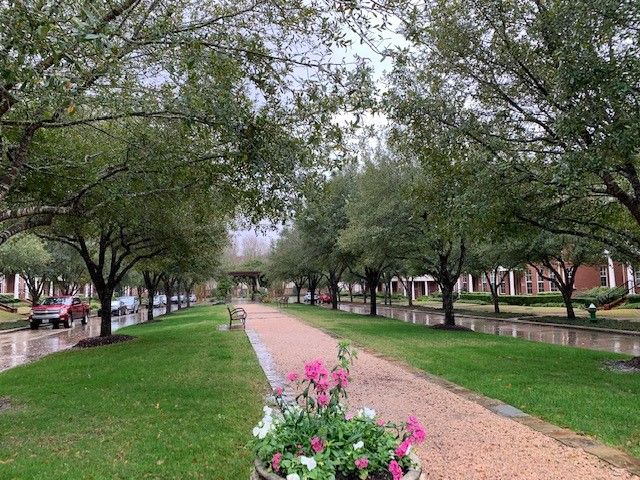 a view of a swimming pool with outdoor seating