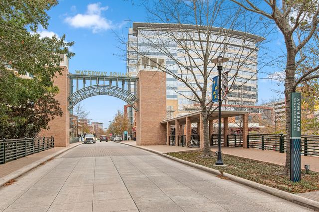 a view of a street with a building in the background