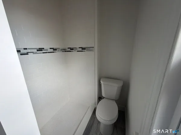 a close view of a toilet in a bathroom