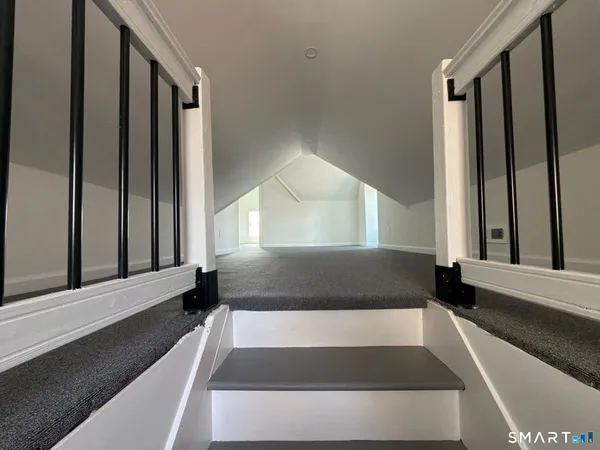 an empty room with wooden floor