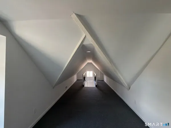 a view of balcony with wooden floor and outdoor seating