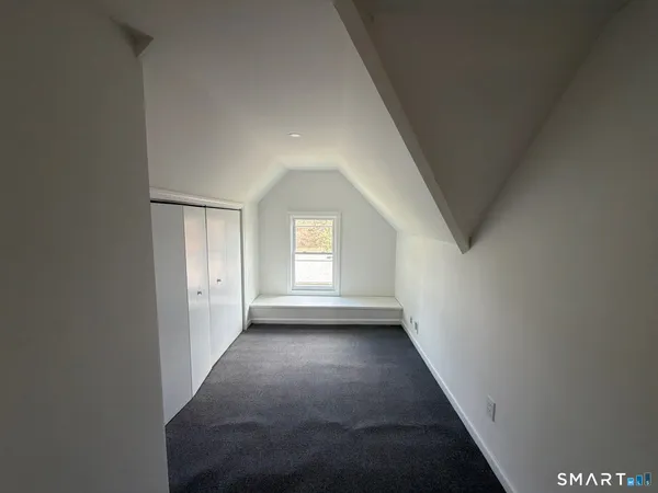 a view of a backyard with a large tree