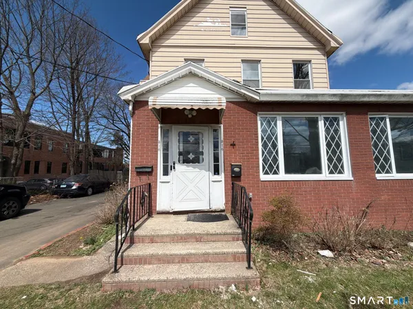 a front view of a house with a porch