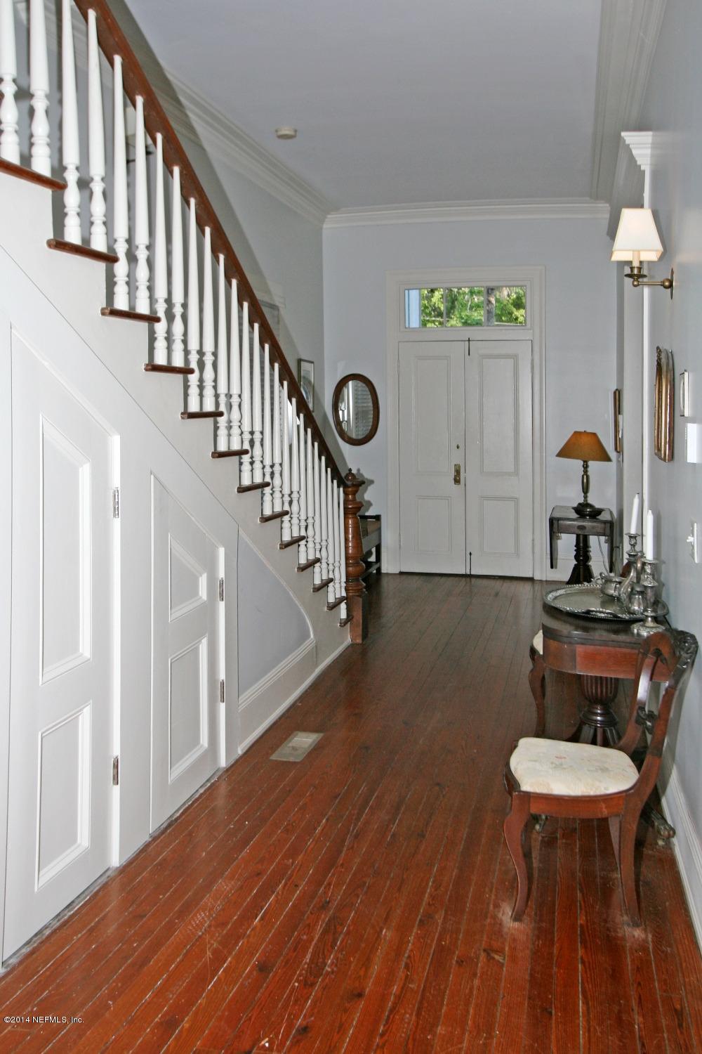 48 Water Street St. Augustine, FL 32084 - Photo 11 of 52 a view of a hallway with wooden floor and staircase