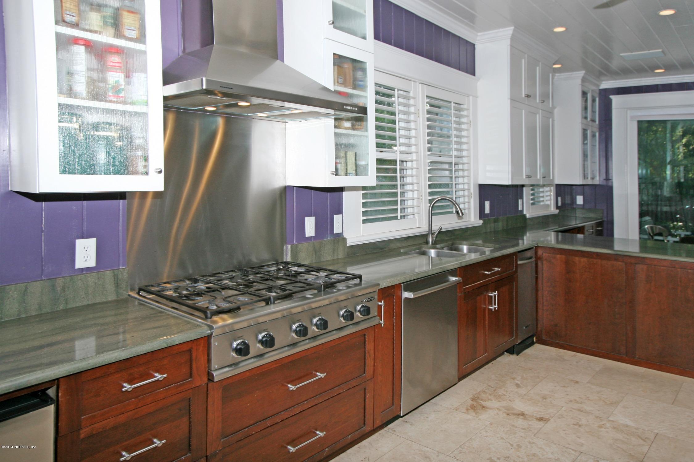 48 Water Street St. Augustine, FL 32084 - Photo 15 of 52 a kitchen with stainless steel appliances granite countertop a stove a sink and a microwave