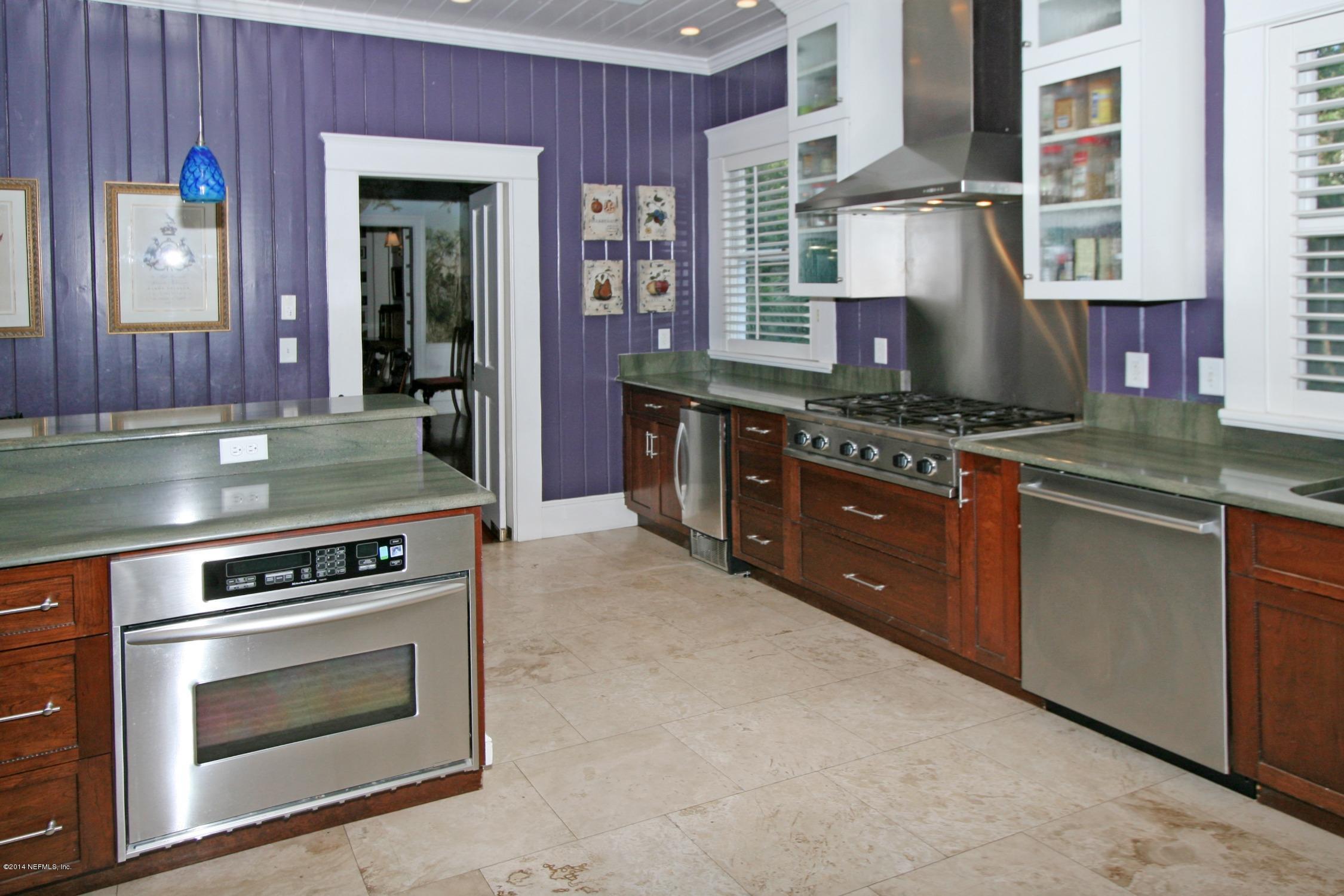 48 Water Street St. Augustine, FL 32084 - Photo 16 of 52 a kitchen with stainless steel appliances granite countertop a stove and a sink