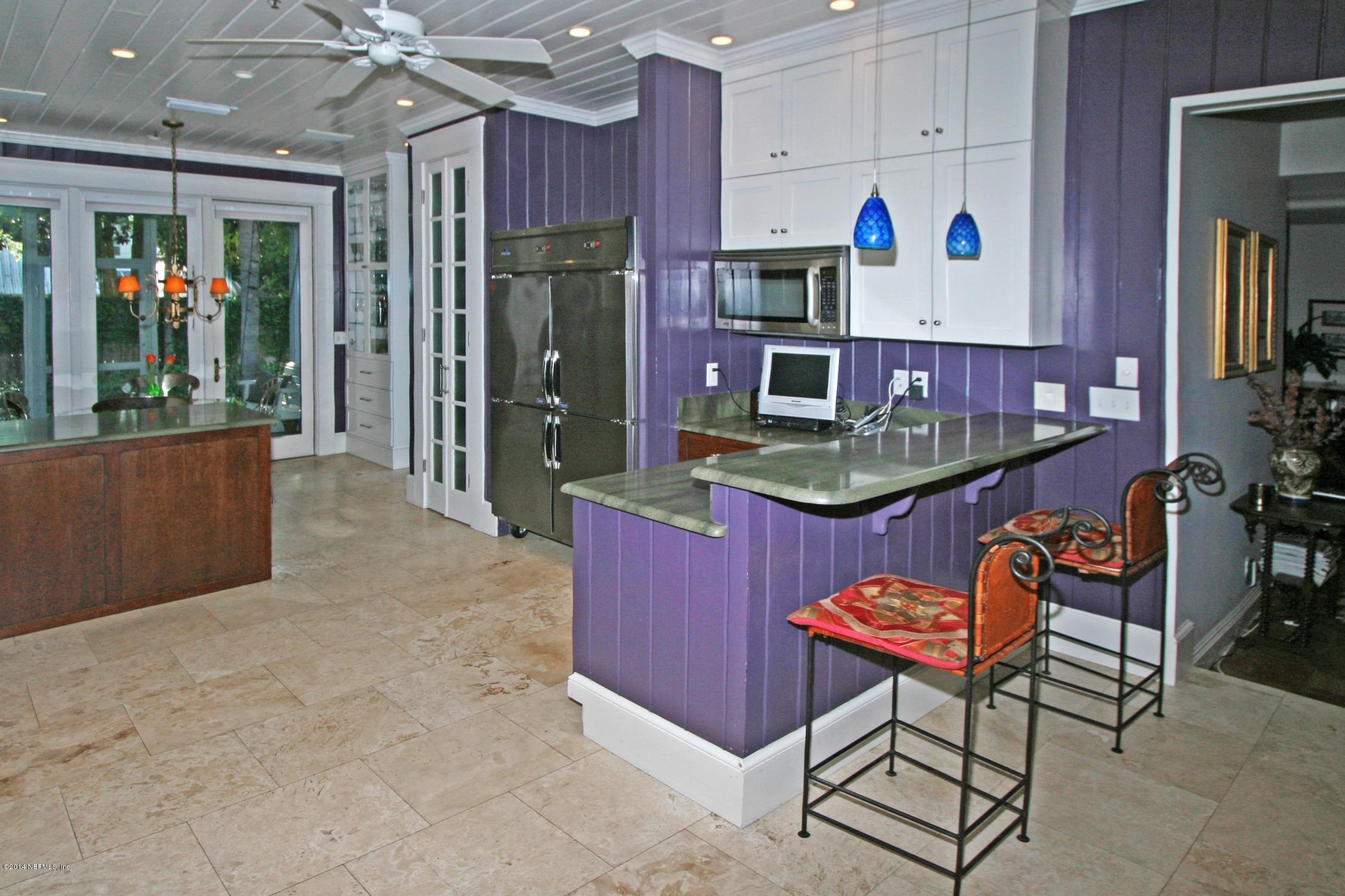 48 Water Street St. Augustine, FL 32084 - Photo 17 of 52 a room with lots of furniture and white walls