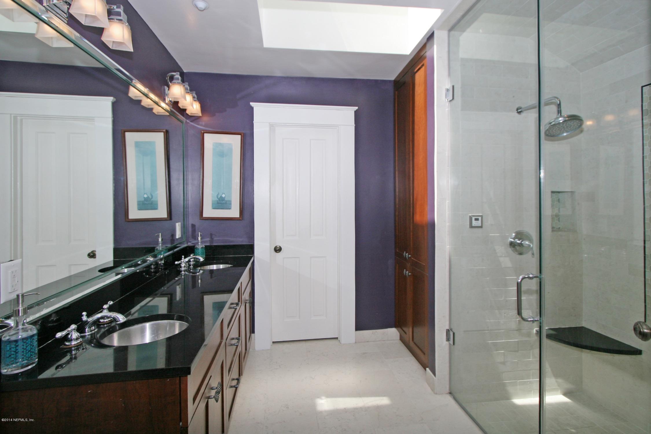 48 Water Street St. Augustine, FL 32084 - Photo 25 of 52 a bathroom with a sink and a mirror