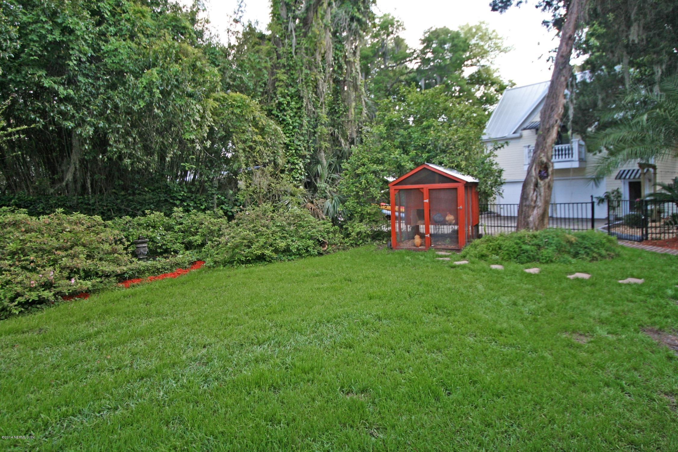 48 Water Street St. Augustine, FL 32084 - Photo 30 of 52 a front view of a house with garden