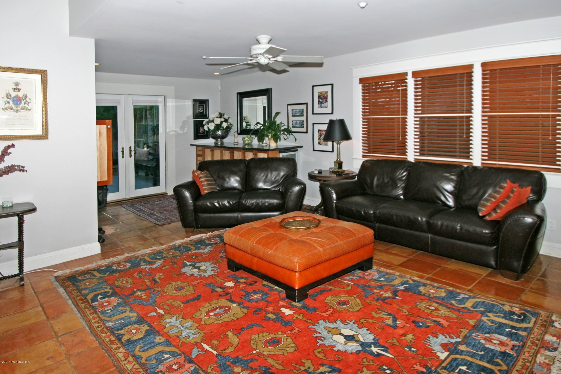 48 Water Street St. Augustine, FL 32084 - Photo 33 of 52 a living room with furniture a rug and a fireplace
