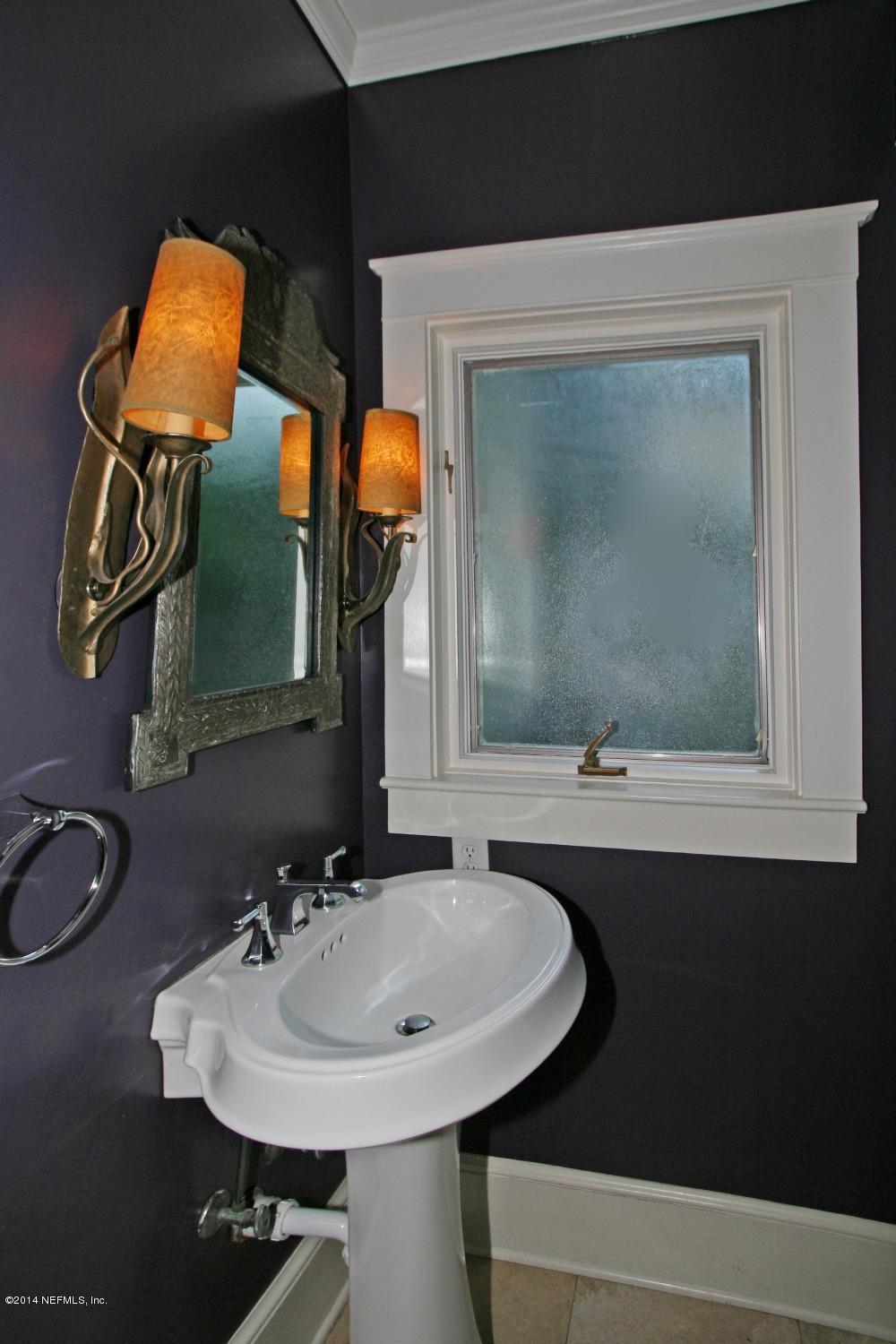 48 Water Street St. Augustine, FL 32084 - Photo 37 of 52 a bathroom with a sink and a mirror