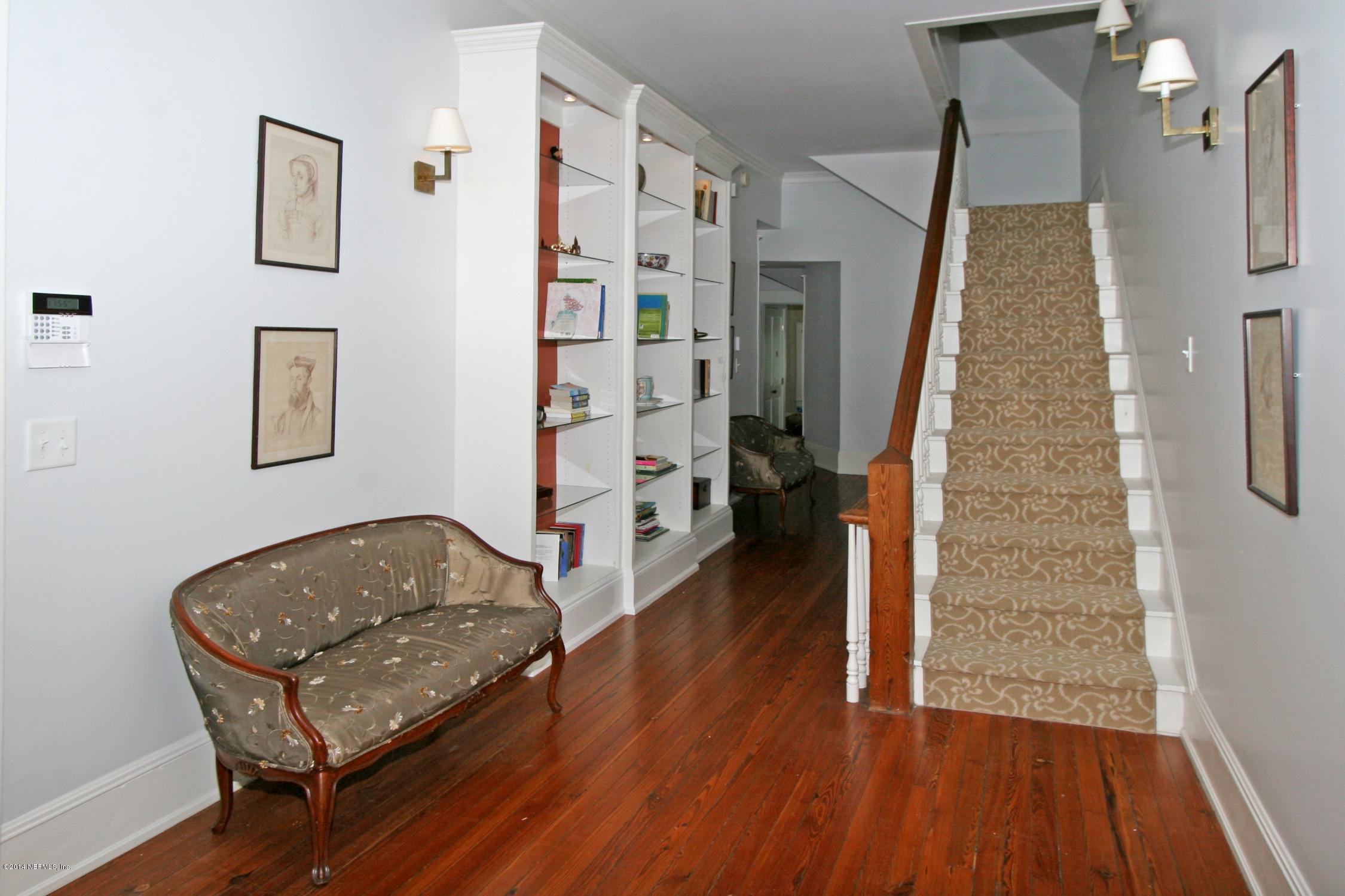 48 Water Street St. Augustine, FL 32084 - Photo 41 of 52 a living room with furniture and a wooden floor